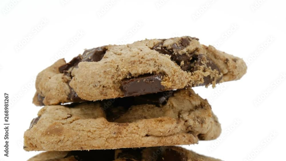 chocolate chip cookies or biscuits rotating on white background, sweet dessert cake and candy trans fat chocolate chip unhealthy medicine fat and lose weight. chocolate chip cookies or biscuits rotating on white background, sweet dessert cake and candy trans fat chocolate chip unhealthy medicine fat and lose weight.