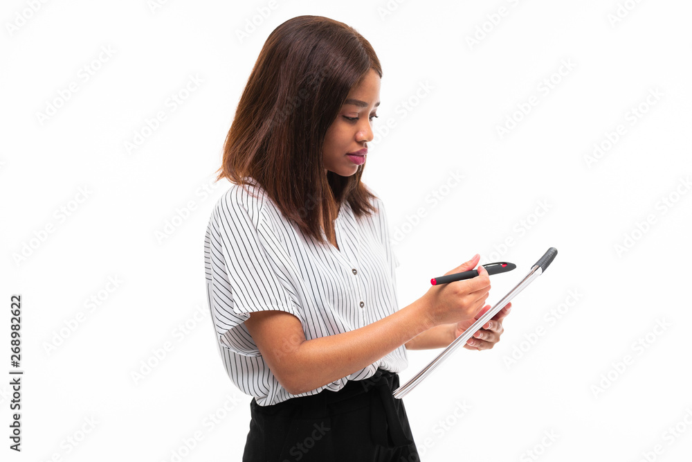 charming dark-skinned young girl explain smth on the plane table isolated on background charming dark-skinned young girl explain smth on the plane table isolated on background