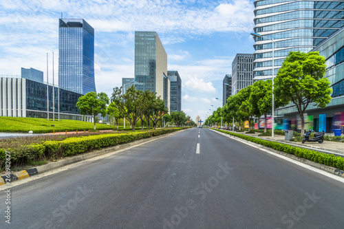 city road through modern buildings in suzhou