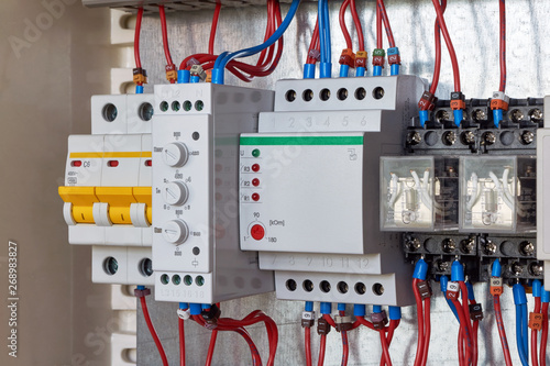 Modular three-phase circuit breaker, phase control relay with adjustments, level control relay, two intermediate relays in electrical Cabinet. Electrical wires are connected according to the diagram.