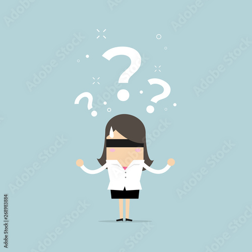 Businesswoman were blindfolded with black cloth. Businesswoman can't see the path.