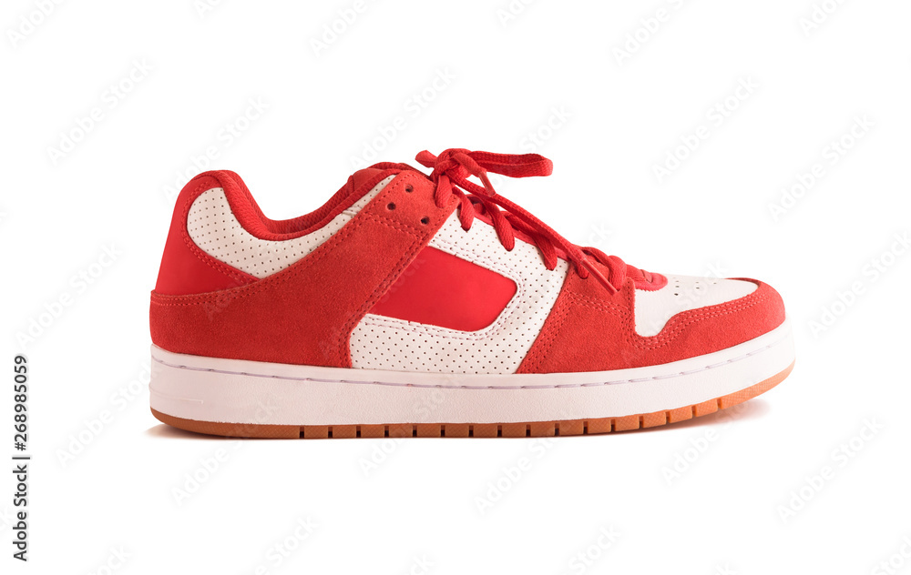 Side view of red gumshoes or skate shoes isolated on white background