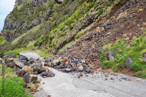 Tableau sur toile Danger mountain landslide stone slope threaten to block road for driver and resident of the city
