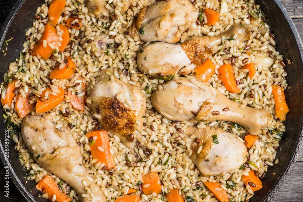 Fried rice with vegetables and chicken in pan. Selective focus. Fried rice with vegetables and chicken in pan. Selective focus.