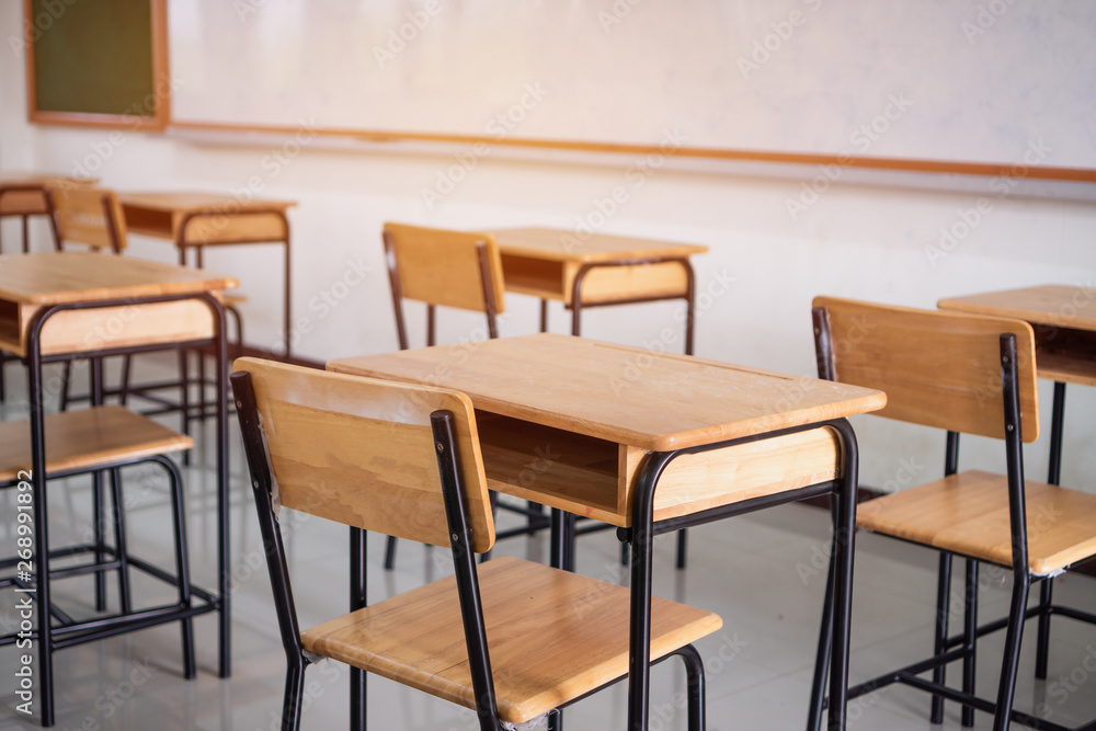 Back to school concept. School empty classroom, Lecture room with desks and chairs iron wood for studying lessons in highschool thailand without young student, interior of secondary education