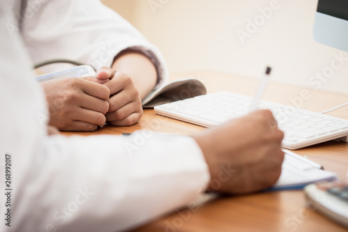Healthcare medical concept : Doctor / psychiatrist consulting gynecological female illness, writing prescription clipboard record information,patient listening receiving in medical clinic hospital.