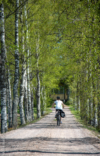 Woman bicycling on the road