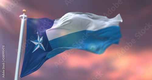 Flag of Dallas at sunset, county of the state of Texas, in United States - loop photo