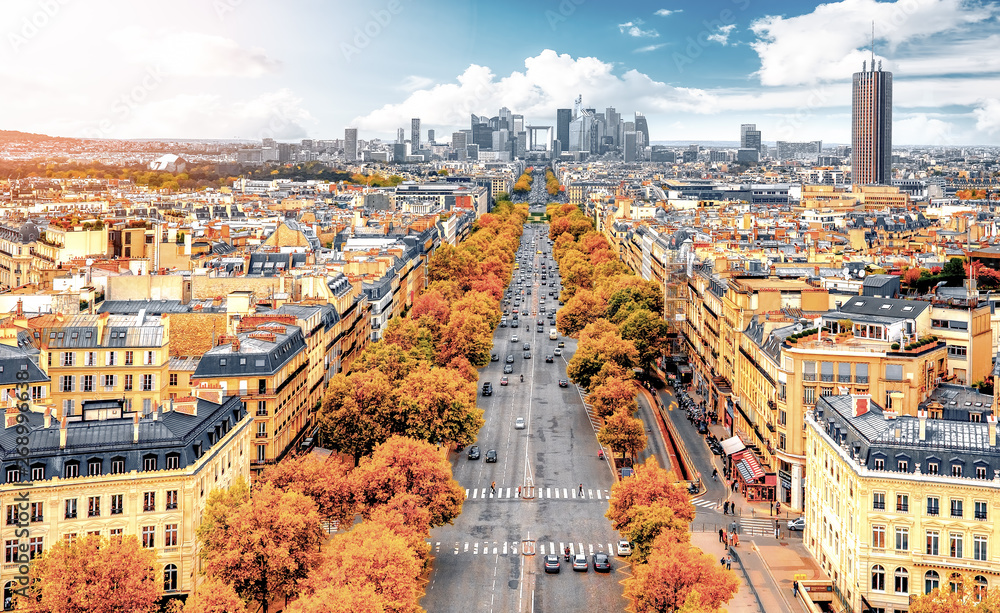 La Defense Financial District Paris France in autumn. Traffic on Champs-Elysees. Trees with orange and yellow leafs.