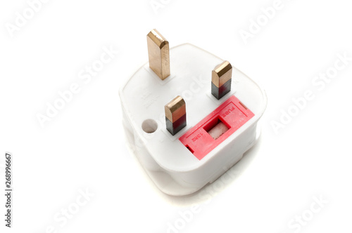 UK wall plug eu travel adapter on white background photo