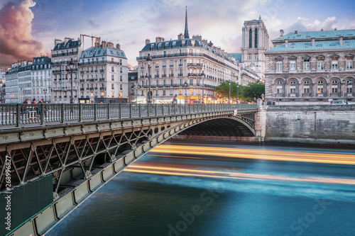 View across Pont d'Arcole at sunset. Notre Dame Cathedral in the background, Paris, France.