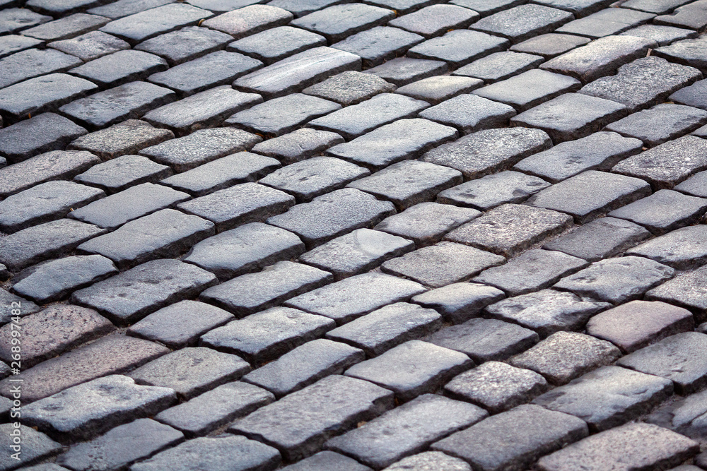 Urban stone paving stones. Backgrounds and textures