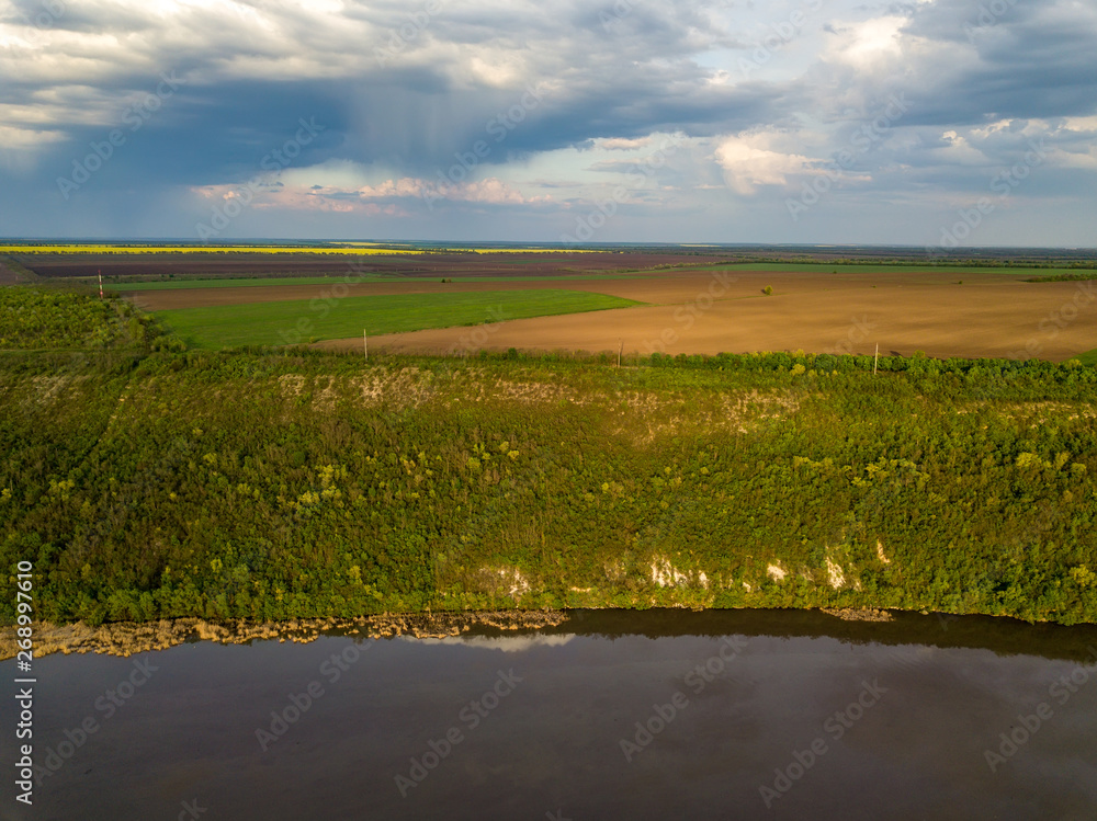 Fototapeta premium Flight over the river and forest at spring time. Dniester river of Moldova republic.