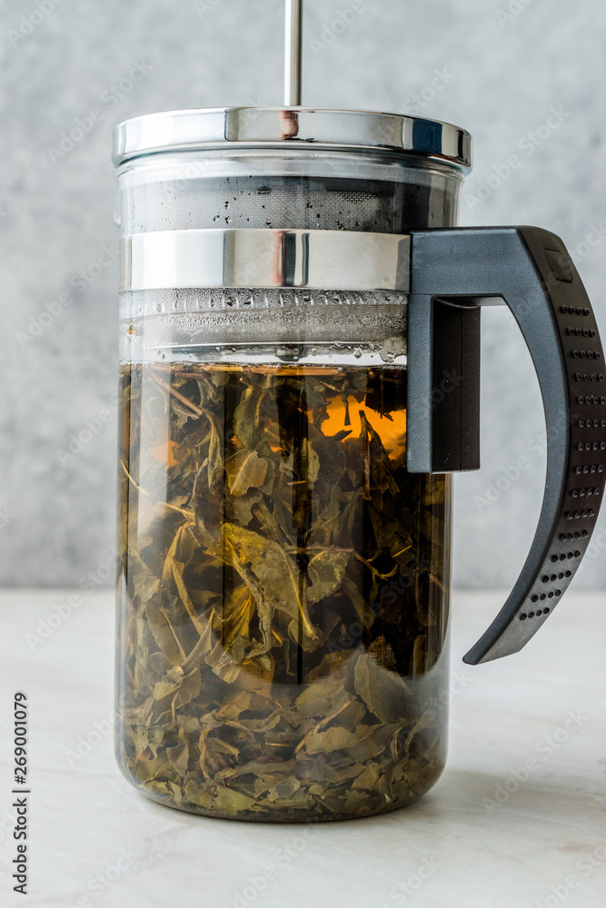 Green Tea with French Press in Daylight Green Tea with French Press in Daylight
