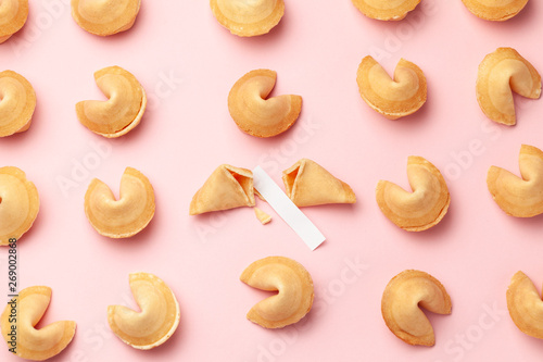 Chinese fortune cookies. Cookies texture pattern with empty blank inside for word prediction. Pink background. photo