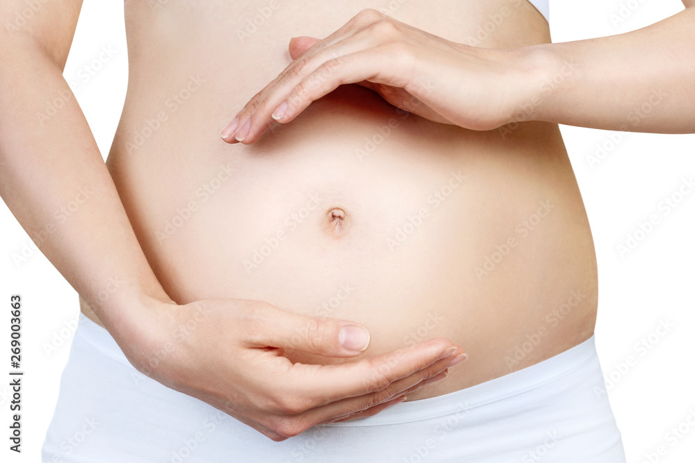 Pregnant woman with belly in the early stages of pregnancy.