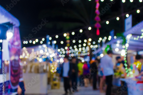 Blur walking street at night fair.