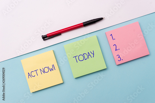 Conceptual hand writing showing Act Now. Concept meaning do not hesitate and start working or doing stuff right away Stationary placed sideways on top of the softhued backdrop