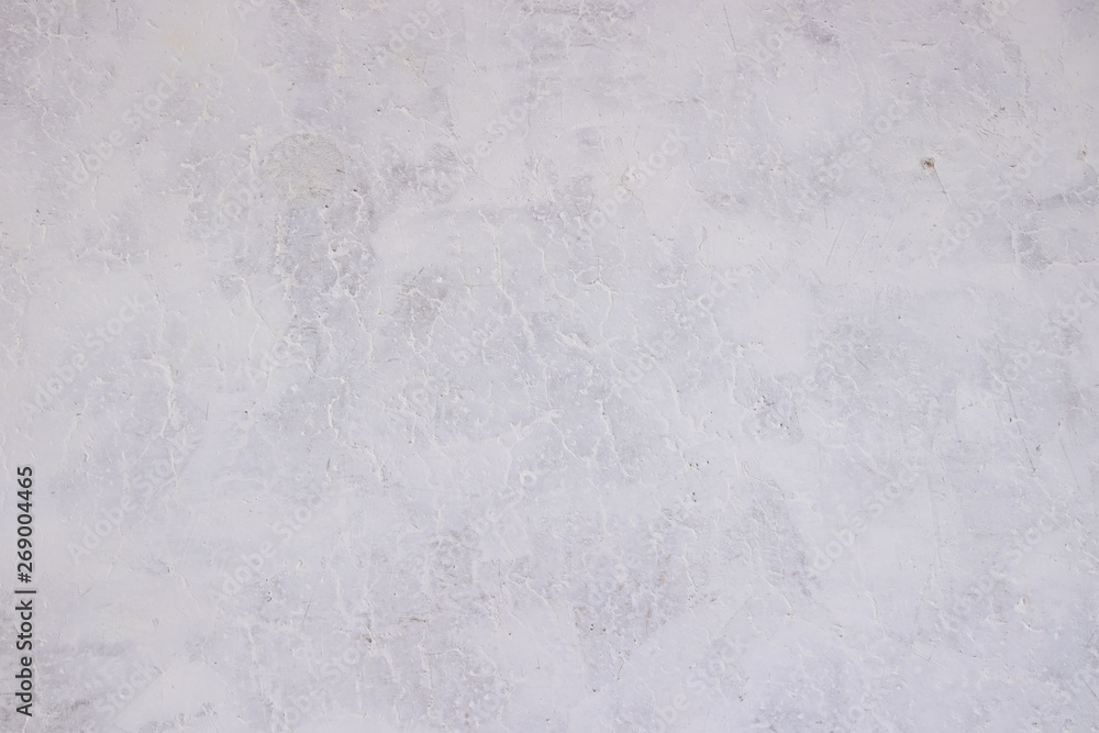Texture concrete wall with putty. A thin layer of putty. White putty on a gray wall.