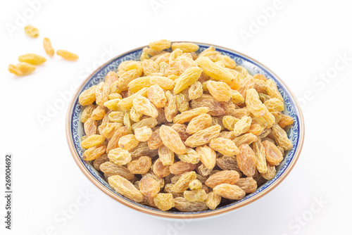 Dried grapes or raisins on white background