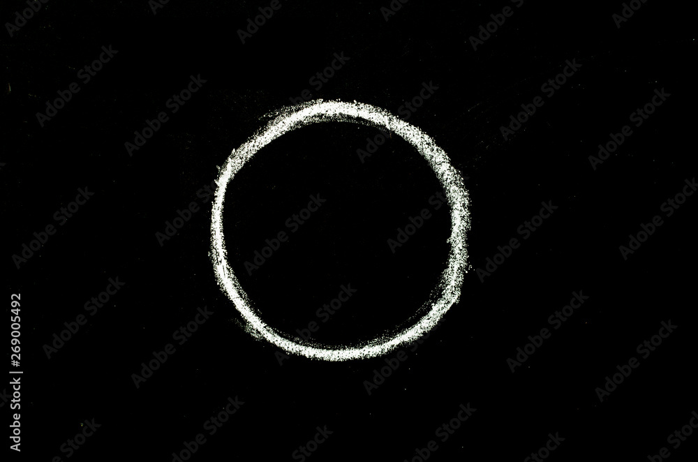 Fototapeta premium white chalk drawn circle on blackboard