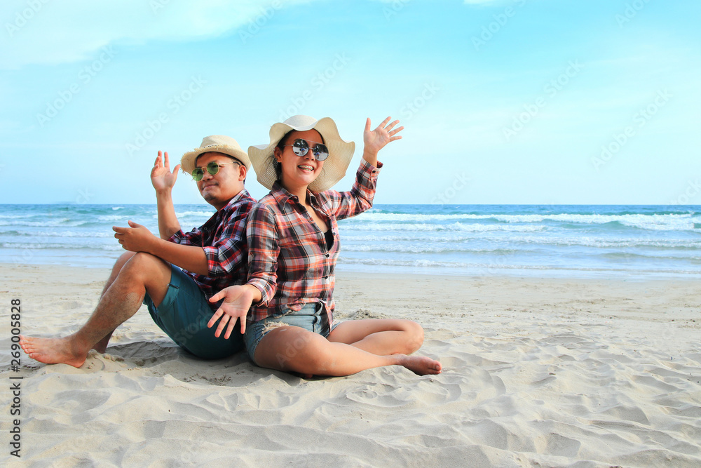 Man and woman wearing a plaid shirt soak up refreshing Man and woman wearing a plaid shirt soak up refreshing