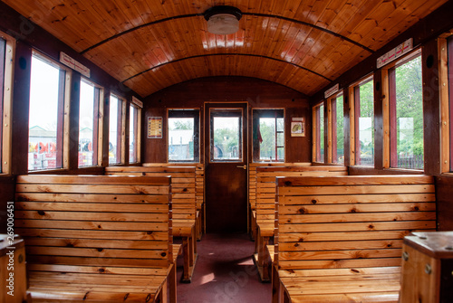 Vintage Train Salon Inside. Old wooden benches in the train in the interior.