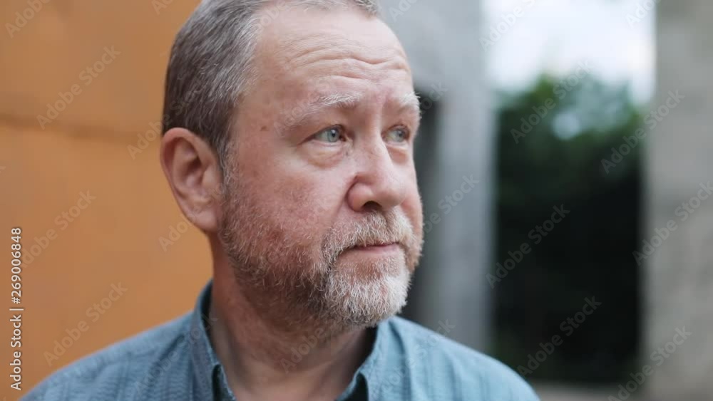 Portrait of attractive grandfather smiling at camera outdoors. Happy old man with smiling face expression. Portrait of attractive grandfather smiling at camera outdoors. Happy old man with smiling face expression.