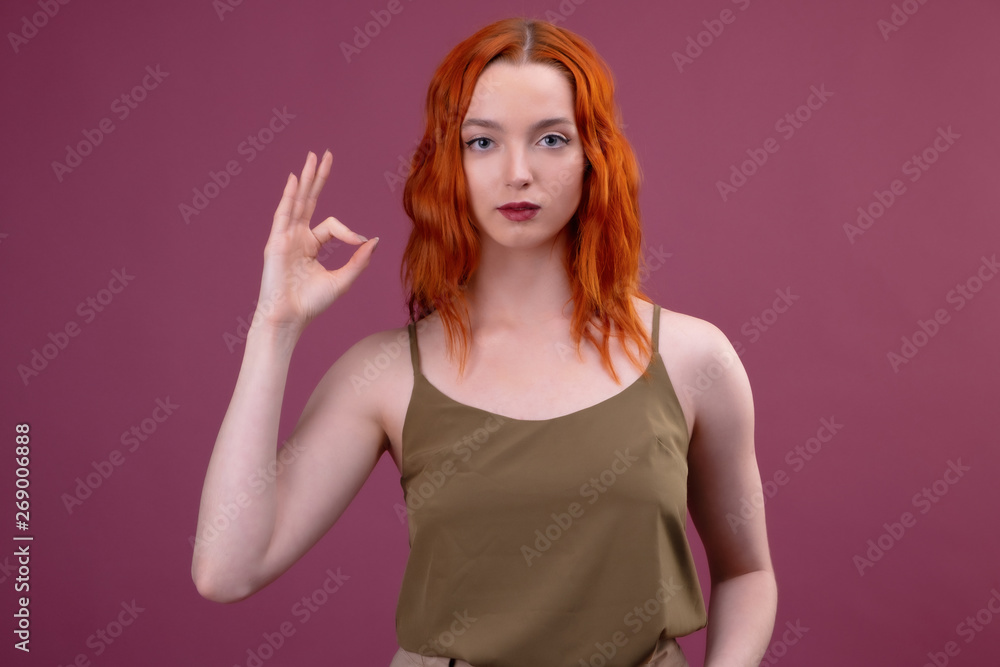 Caucasian redhead woman with ok sign gesture Caucasian redhead woman with ok sign gesture