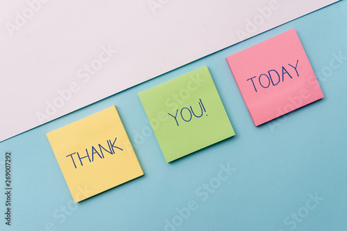 Text sign showing Thank You. Business photo showcasing polite expression used when acknowledging gift service compliment Pastel colour note papers placed sideways on the of softhued backdrop