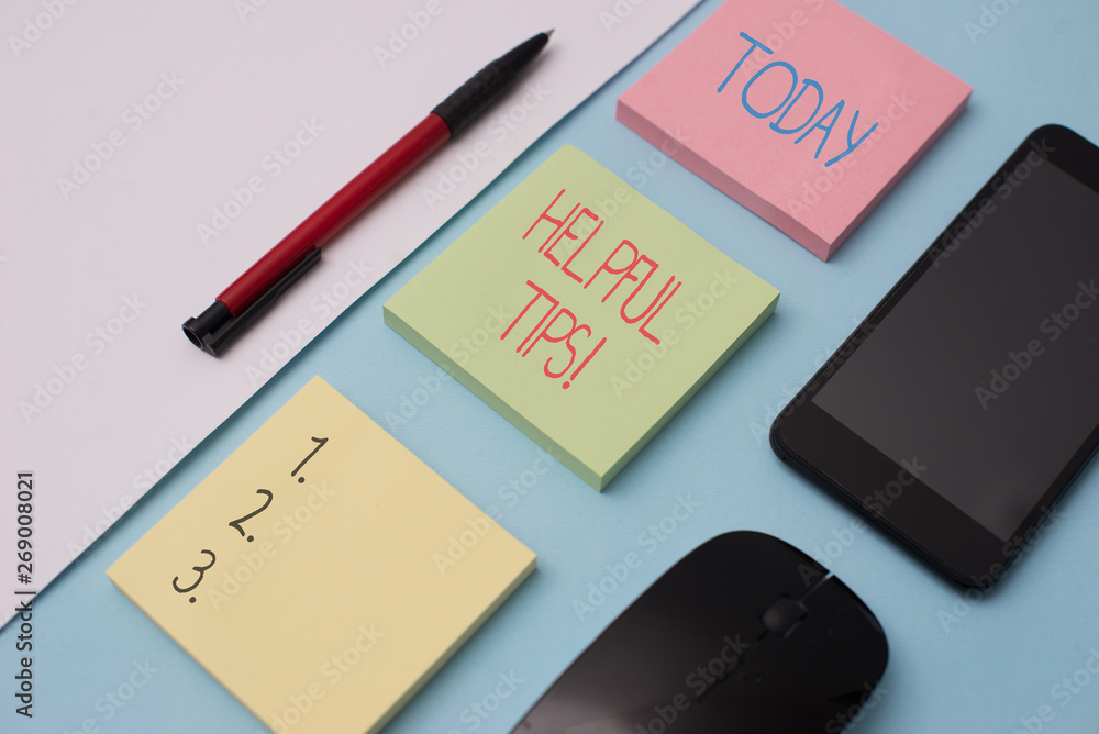 Writing note showing Helpful Tips. Business concept for advices given to be helpful knowledge in life Note papers and stationary plus gadgets placed sideways above backdrop Writing note showing Helpful Tips. Business concept for advices given to be helpful knowledge in life Note papers and stationary plus gadgets placed sideways above backdrop