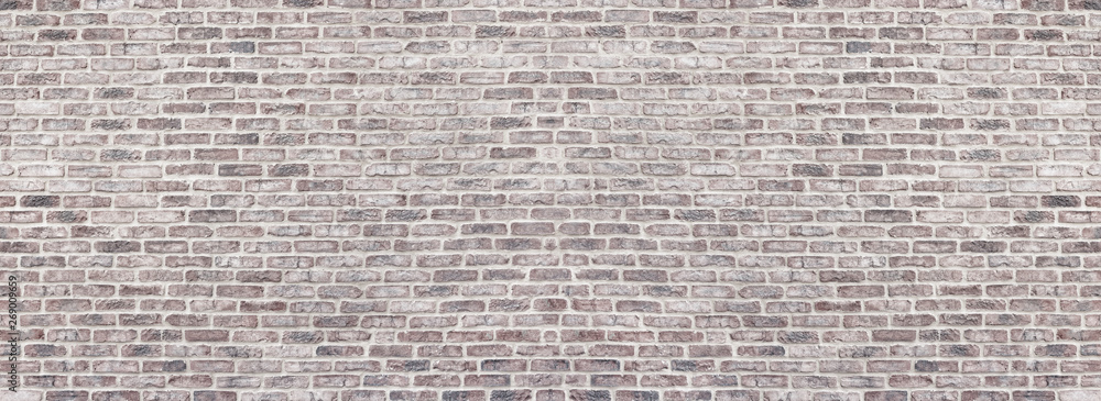 Fototapeta Szeroka jasnoczerwona odrapana ściana z cegieł. Panorama starego muru. Białkującego szorstkiego brickwork rocznika panoramiczny tło