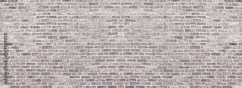 Photo Wide light red shabby brick wall texture