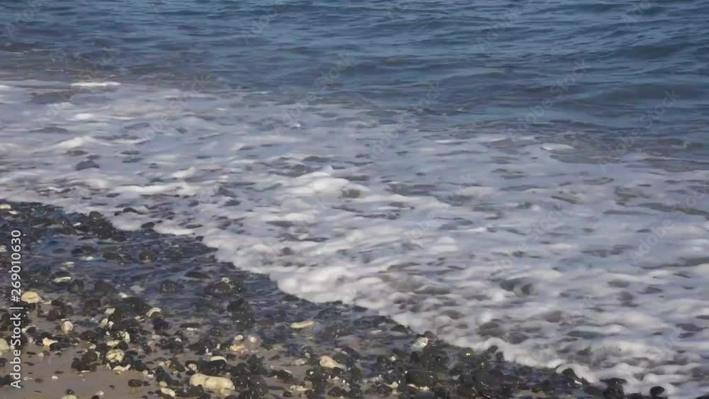 Waves breaking on pebbly beach in slow motion Waves breaking on pebbly beach in slow motion