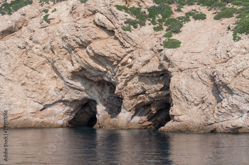 two entrances into caves carved by the ocean