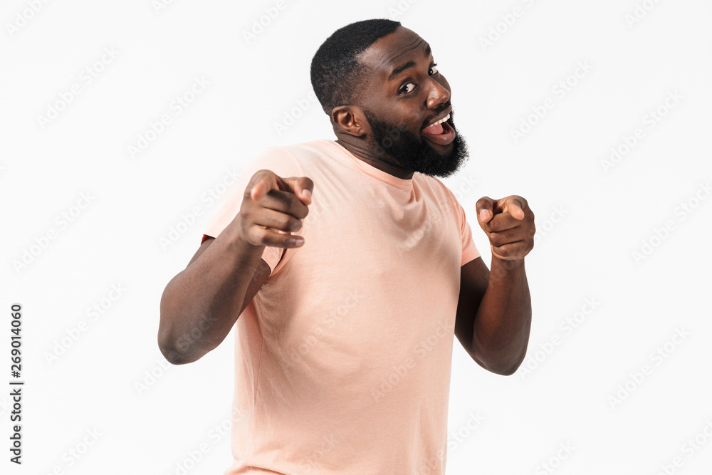 Portrait of a happy excited african man wearing t-shirt Portrait of a happy excited african man wearing t-shirt