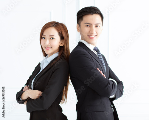 Young smiling business woman and business man