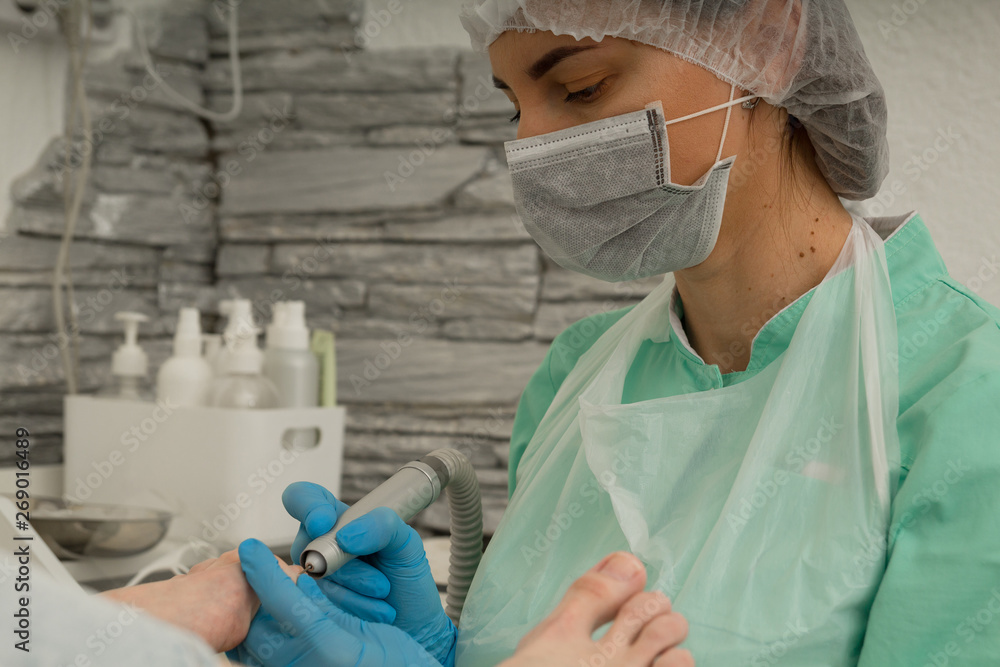 Podology. The doctor podolog makes medical pedicure. Feet care. Cosmetology Podology. The doctor podolog makes medical pedicure. Feet care. Cosmetology