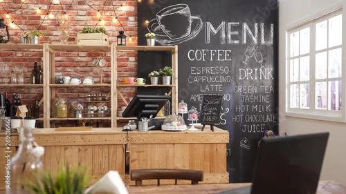 Obraz Nowoczesne wnętrza kawiarni z drewnianym stołem