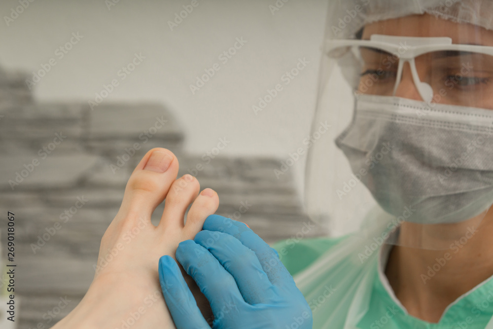 Fototapeta premium Podology. The doctor podolog makes medical pedicure. Feet care. Cosmetology