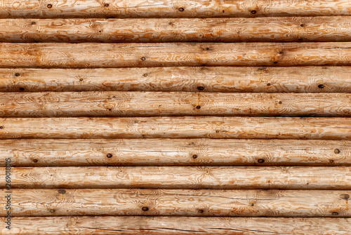 textured wooden background from boards of logs