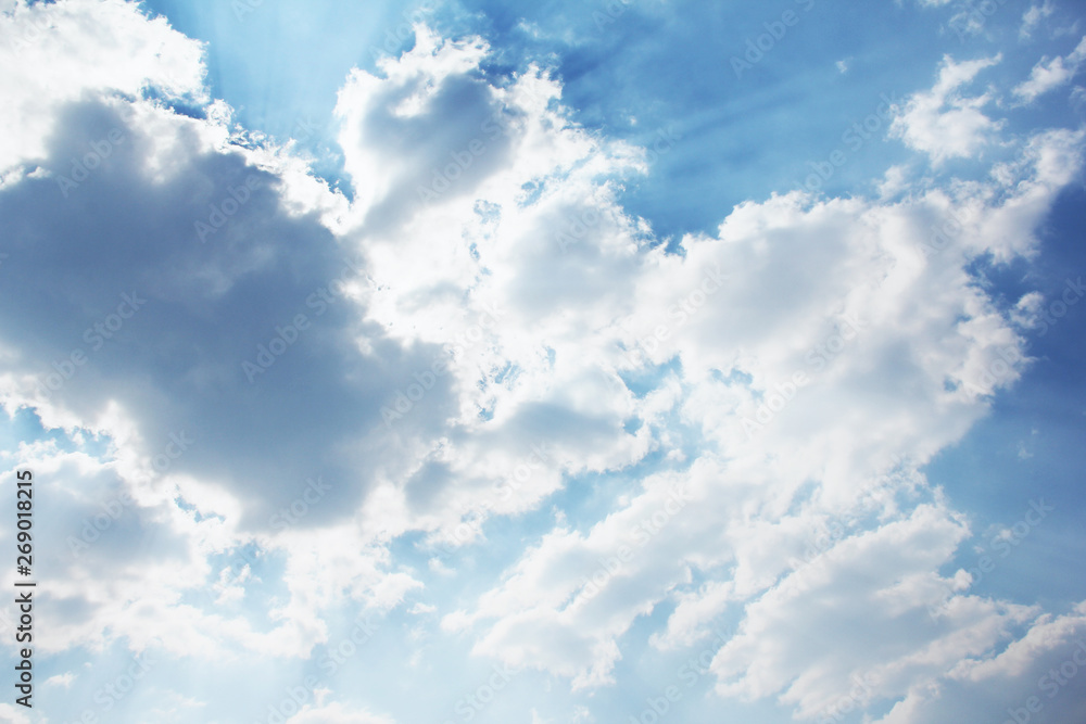 Obraz premium Beautiful sky. Rays of the sun behind the clouds. Background