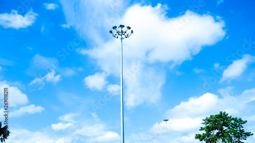 Street Public lighting pole against a blue sky and cloud background.