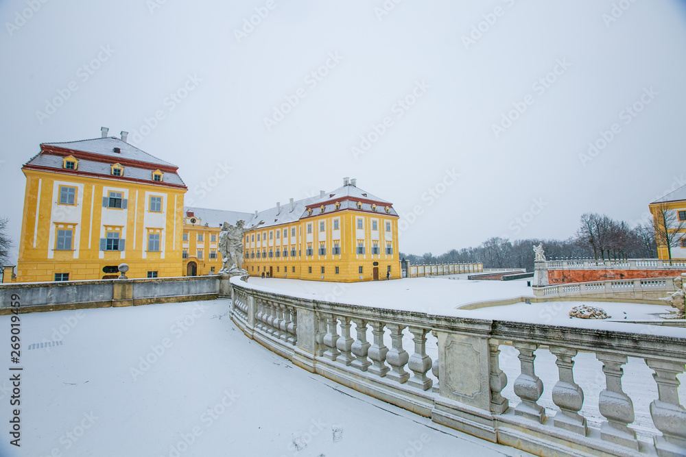 Fototapeta premium Schloss Hof, Austria - February 20, 2017:Schloss Hof is a baroque palace in Lower Austria, which privious owners include Prince Eugene of Savoy and Maria Theresia,with falling snow.