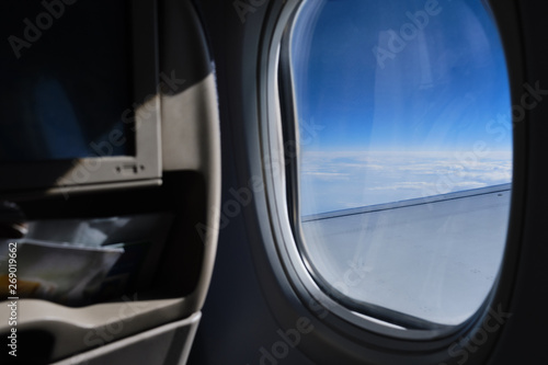 Porthole sky view. Commercial airplane window view from passenger seat © Anton