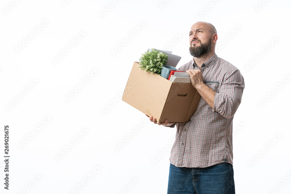 fired office worker with a box of personal belongings fired office worker with a box of personal belongings