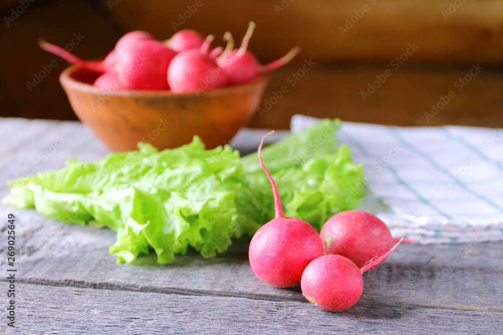 Fresh radish on a wooden background. Fresh radish on a wooden background.