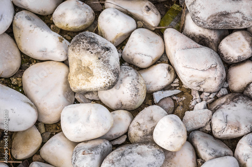 Round sea stones on the shore.