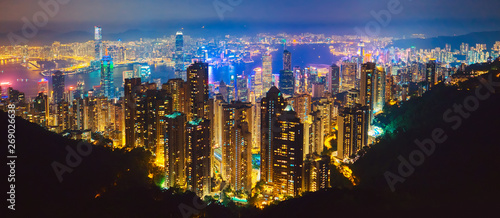 The most famous view of Hong Kong at twilight sunset. Hong Kong skyscrapers skyline cityscape view from Victoria Peak illuminated in the evening. Hong Kong  special administrative region in China.