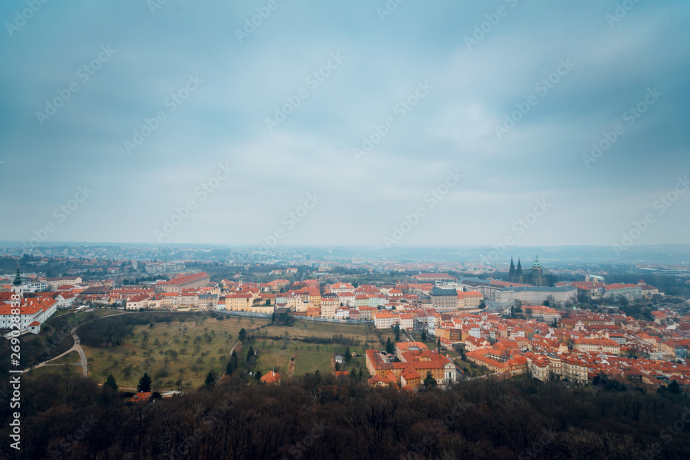View of the historical architectural buildings with red roofs from an observation deck in Prague, Czhech Republic. Aerial top view
